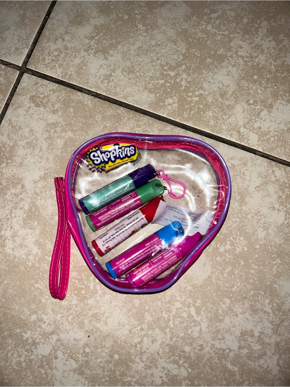 Shopkins lip balm set with 5 scented lip balms in a clear heart-shaped case